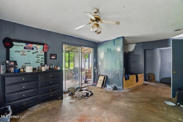 9 Gail St, Hattiesburg, MS 39402 - bedroom with concrete flooring, access to outside, a textured ceiling, and a ceiling fan