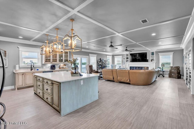 15225 Branigar, Biloxi, MS 39532 - kitchen with coffered ceiling, a chandelier, recessed lighting, a glass covered fireplace, and light countertops