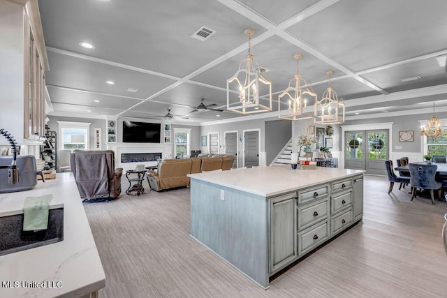 15225 Branigar, Biloxi, MS 39532 - kitchen with a chandelier, coffered ceiling, gray cabinetry, light wood-style flooring, and ceiling fan