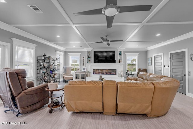 15225 Branigar, Biloxi, MS 39532 - living area featuring ceiling fan, coffered ceiling, recessed lighting, a glass covered fireplace, and light wood-style flooring