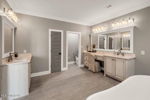 15225 Branigar, Biloxi, MS 39532 - full bathroom with vanity, a soaking tub, wood finished floors, and ornamental molding