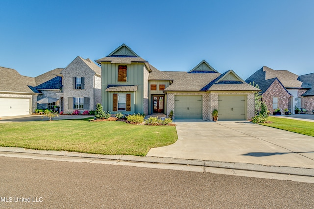 view of front of house with a front lawn and a garage