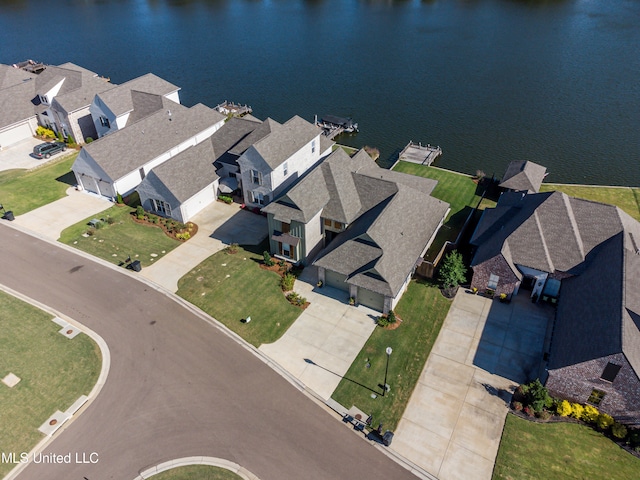 birds eye view of property with a water view