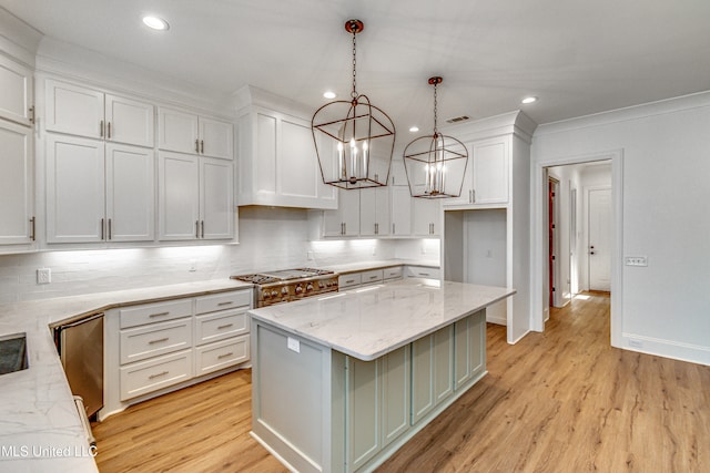 kitchen with white cabinetry, light hardwood / wood-style flooring, a center island, and pendant lighting