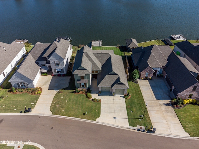 drone / aerial view with a water view