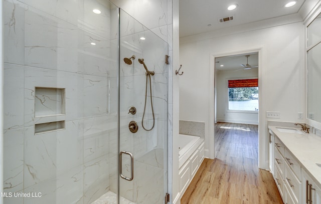 bathroom featuring hardwood / wood-style floors, ceiling fan, independent shower and bath, vanity, and crown molding