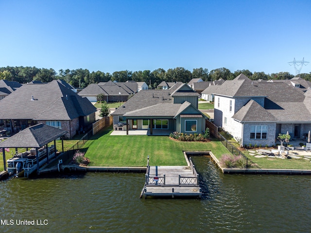 dock area featuring a water view, a patio area, a lawn, and a gazebo