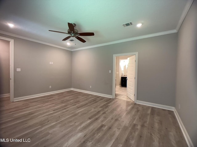 5807 Sylvester St, Ocean Springs, MS 39564 - empty room featuring ceiling fan, wood finished floors, baseboards, and ornamental molding