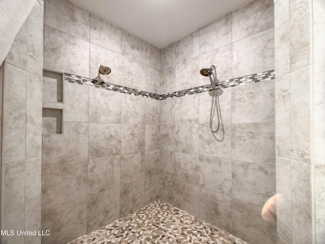 5807 Sylvester St, Ocean Springs, MS 39564 - bathroom featuring a tile shower
