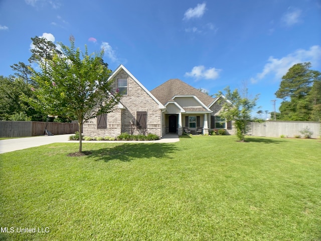 5807 Sylvester St, Ocean Springs, MS 39564 - craftsman-style house with driveway, brick siding, and roof with shingles