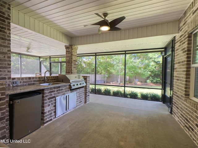 5807 Sylvester St, Ocean Springs, MS 39564 - unfurnished sunroom with a sink, area for grilling, and a ceiling fan