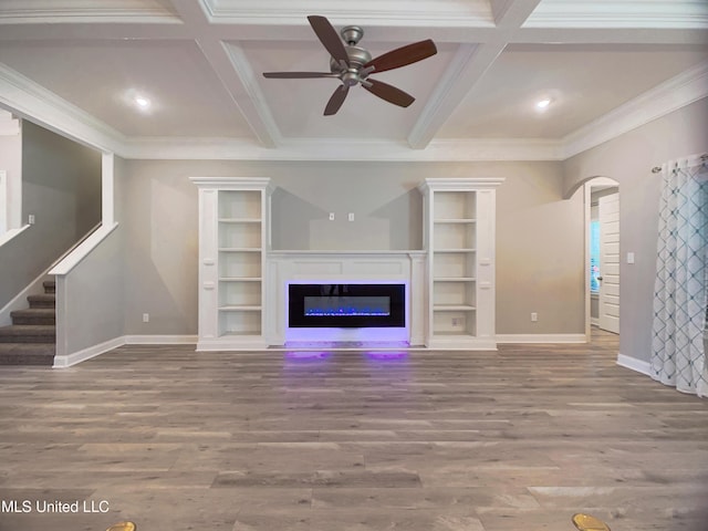 5807 Sylvester St, Ocean Springs, MS 39564 - unfurnished living room with coffered ceiling, baseboards, ceiling fan, wood finished floors, and arched walkways