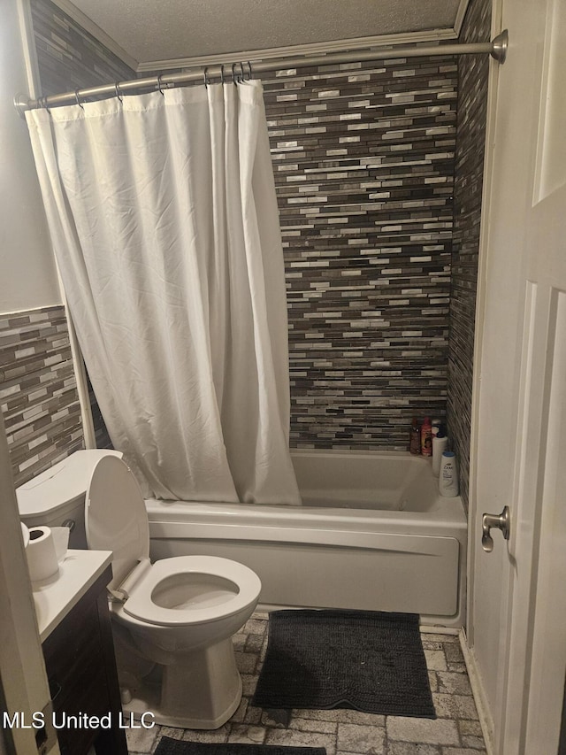 full bath featuring shower / bathtub combination with curtain, toilet, and vanity