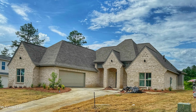 french provincial home featuring a front yard