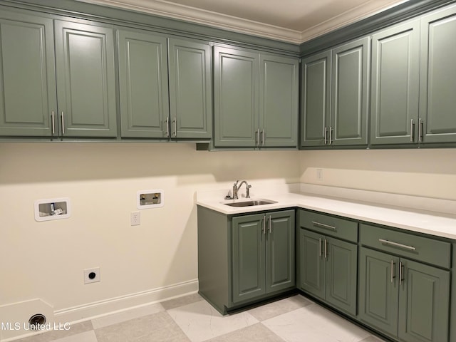 laundry room with cabinets, hookup for a washing machine, ornamental molding, electric dryer hookup, and sink