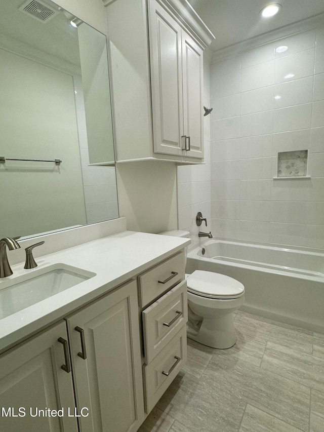 full bathroom with vanity, shower / bath combination, toilet, and crown molding