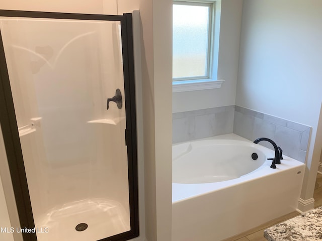 10241 Patrick Dr, Gulfport, MS 39503 - full bathroom with a shower stall and a bath