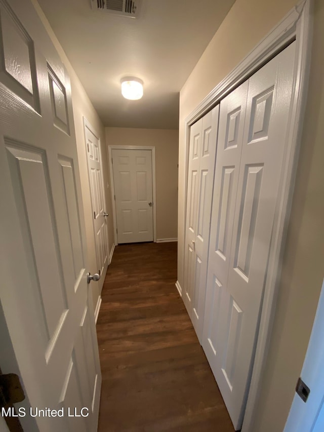 hallway featuring dark wood-type flooring