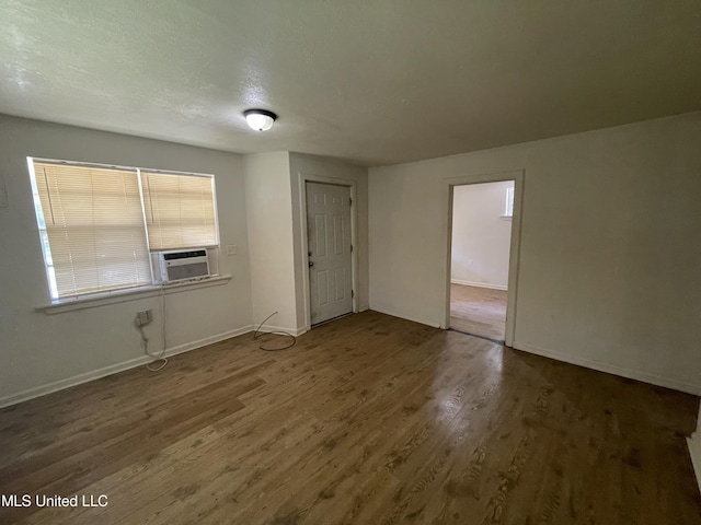 3701 14th St, Gulfport, MS 39501 - unfurnished room with wood finished floors, baseboards, and cooling unit