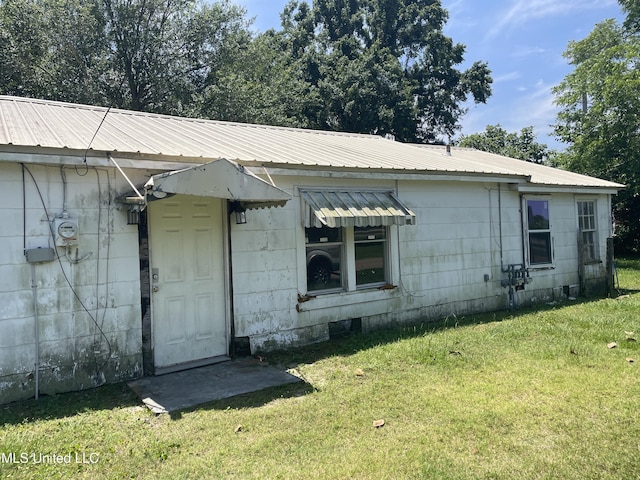 3701 14th St, Gulfport, MS 39501 - back of property with a yard and metal roof