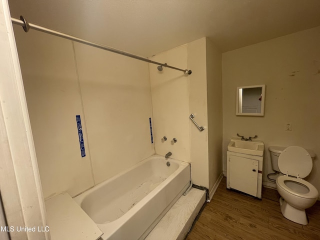 3701 14th St, Gulfport, MS 39501 - full bathroom featuring toilet, wood finished floors, tub / shower combination, and vanity