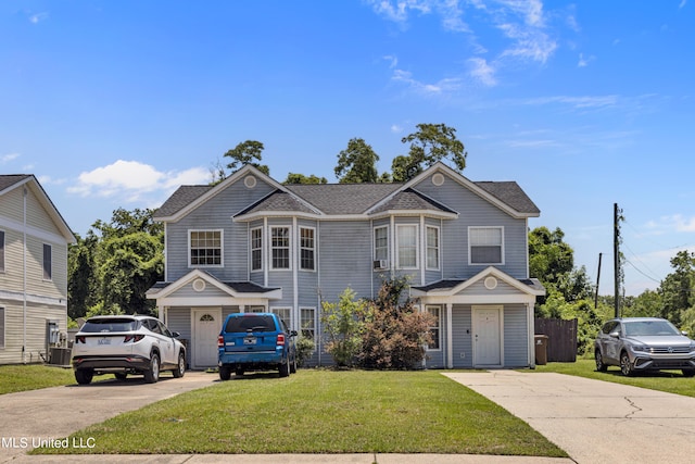 front facade with a front lawn