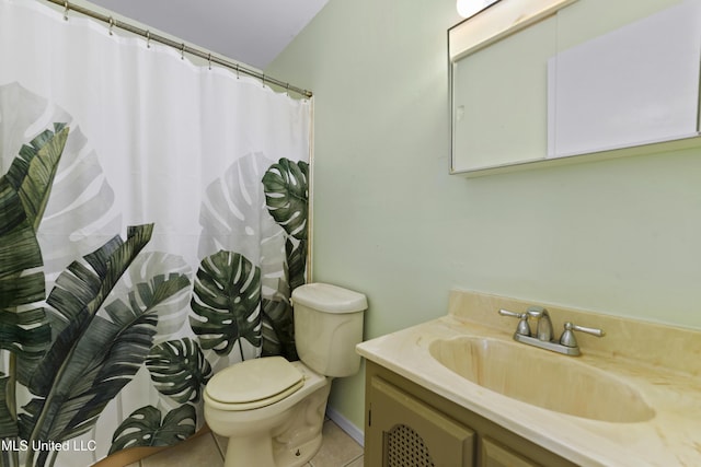 bathroom featuring toilet, vanity, and tile patterned floors