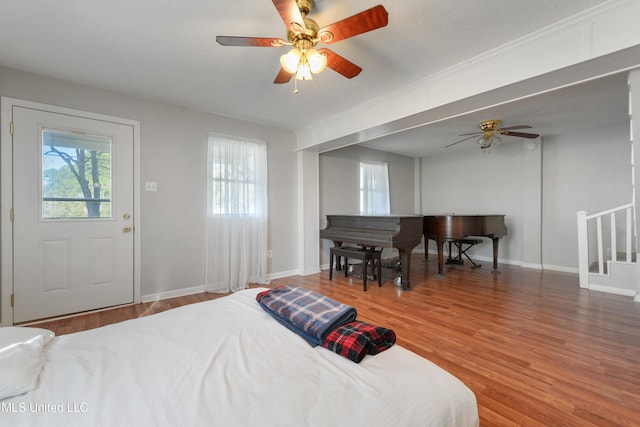 bedroom featuring ceiling fan and wood-type flooring