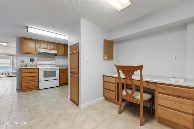 kitchen featuring backsplash, white range with electric cooktop, built in desk, and a textured ceiling