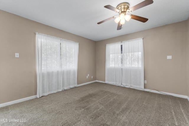 empty room with carpet and ceiling fan