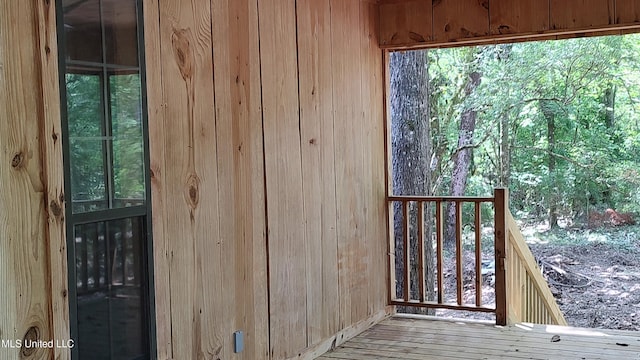 exterior space featuring wooden walls
