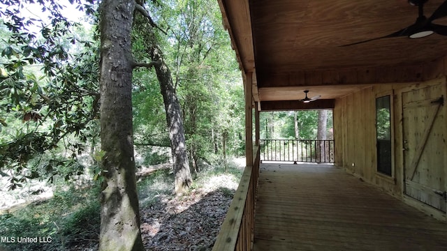 wooden deck with ceiling fan