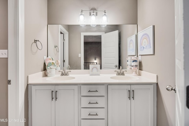 full bathroom featuring a sink and double vanity