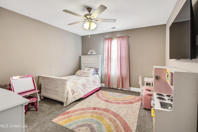 carpeted bedroom with a ceiling fan, visible vents, and baseboards