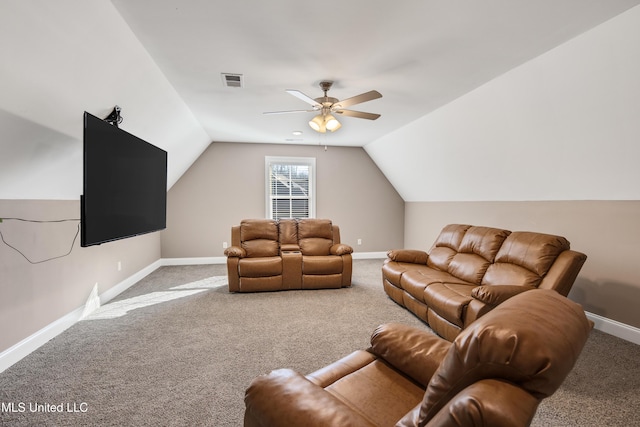 carpeted living area featuring baseboards, visible vents, vaulted ceiling, and a ceiling fan