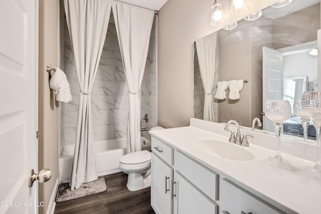 bathroom featuring vanity, wood finished floors, toilet, and shower / bathtub combination with curtain