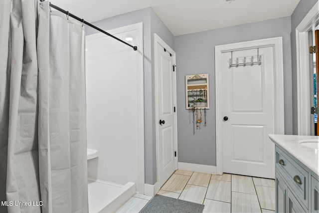 bathroom with vanity and walk in shower