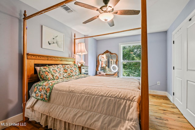 bedroom featuring light hardwood / wood-style flooring and ceiling fan