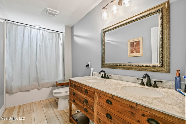 full bathroom featuring vanity, shower / bath combination with curtain, hardwood / wood-style flooring, and toilet