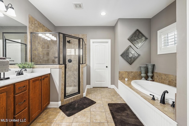 full bath with tile patterned floors, visible vents, a garden tub, a shower stall, and vanity