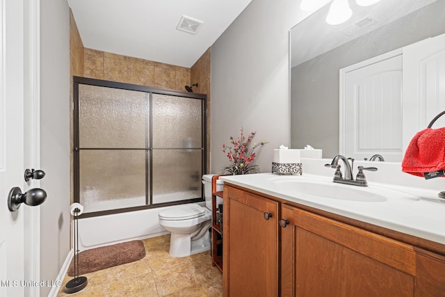 full bathroom featuring visible vents, toilet, vanity, and shower / bath combination with glass door