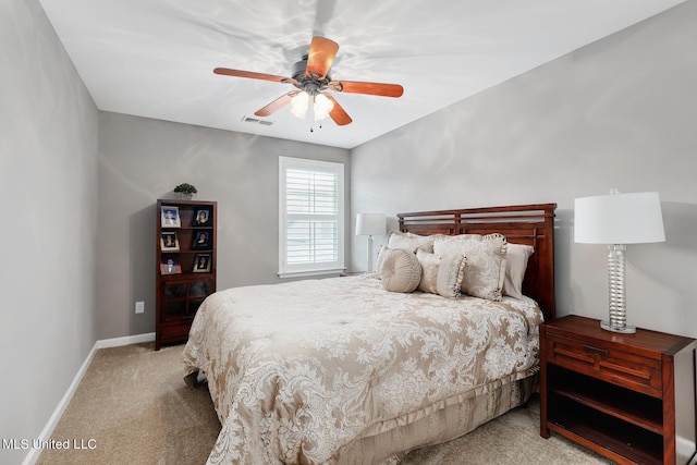 bedroom featuring visible vents, a ceiling fan, baseboards, and light carpet