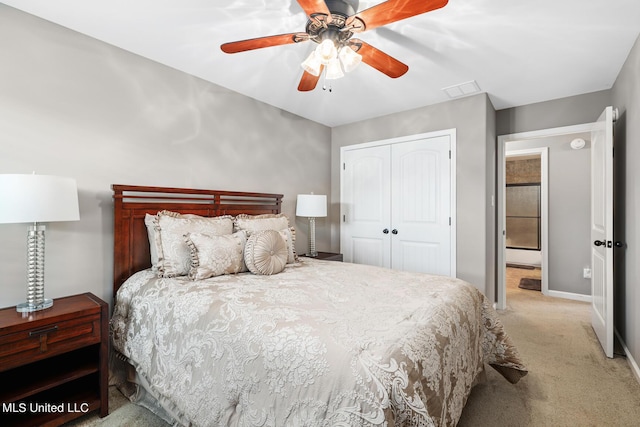 bedroom with visible vents, ceiling fan, baseboards, carpet flooring, and a closet