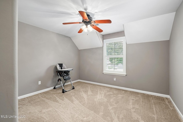 additional living space featuring lofted ceiling, baseboards, carpet floors, and ceiling fan