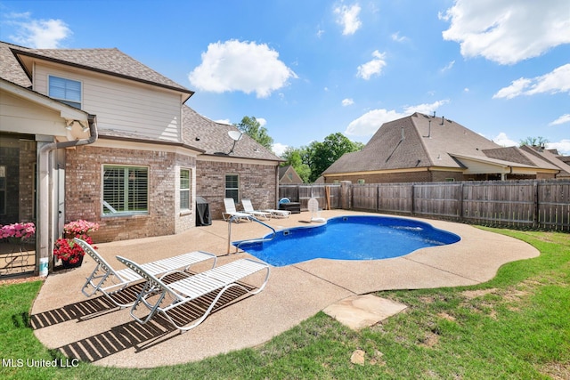 view of pool with a patio area, a fenced in pool, and a fenced backyard