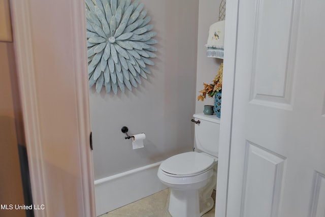 bathroom featuring tile patterned flooring and toilet