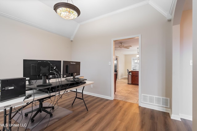 office with crown molding, vaulted ceiling, and hardwood / wood-style flooring