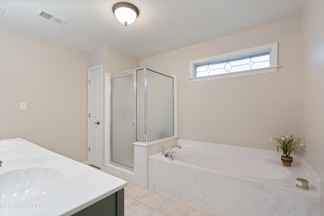 bathroom with vanity, plus walk in shower, and tile patterned flooring