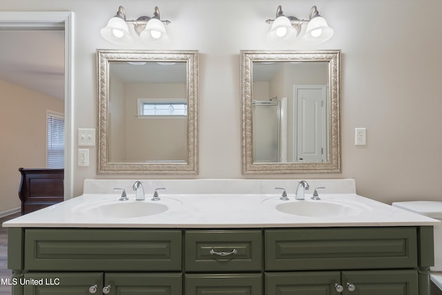 bathroom featuring walk in shower, vanity, and toilet