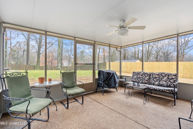 sunroom / solarium with ceiling fan